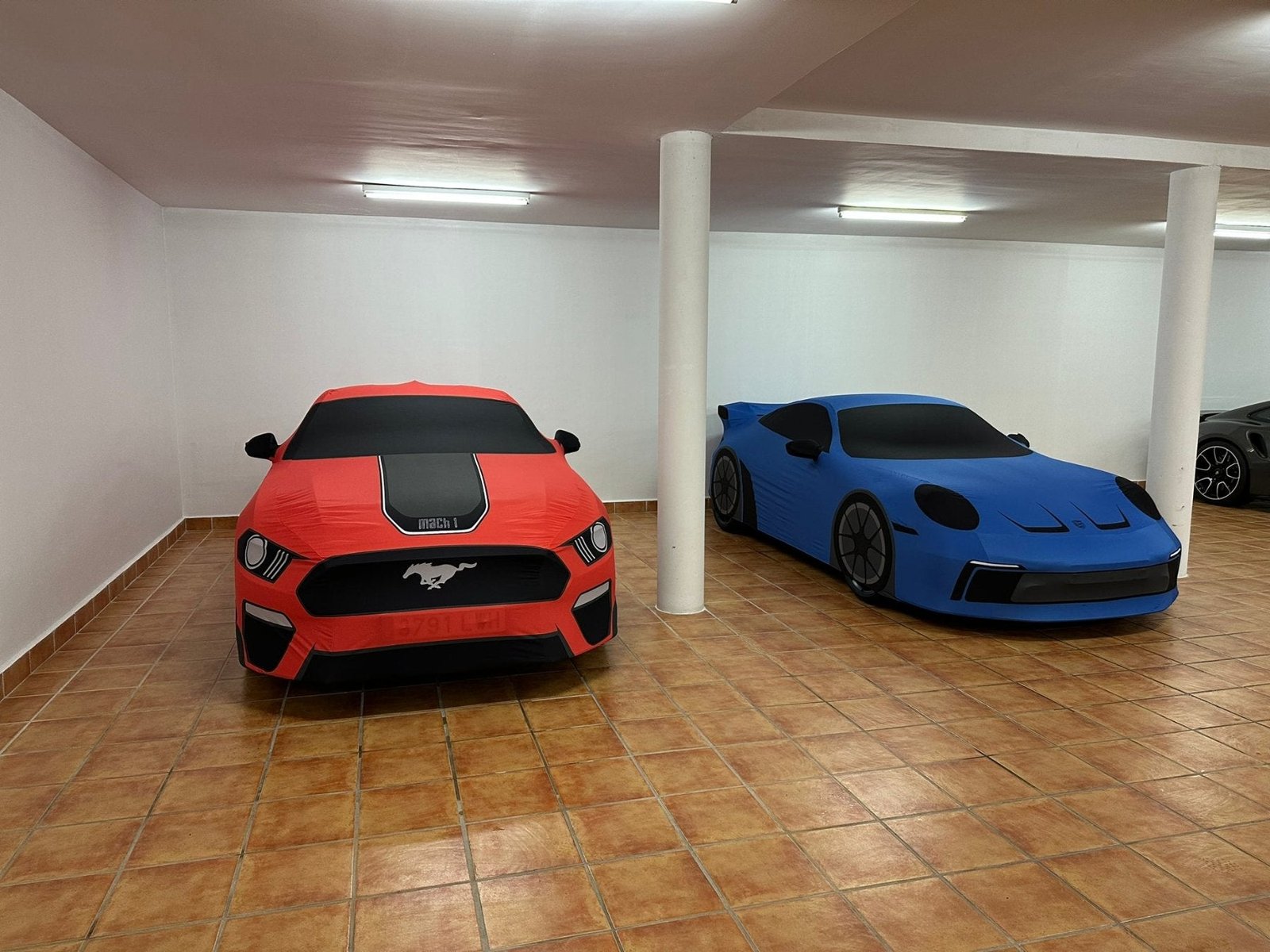 bespoke_car_covers a mustang and a porsche covered by our printed made to measure covers